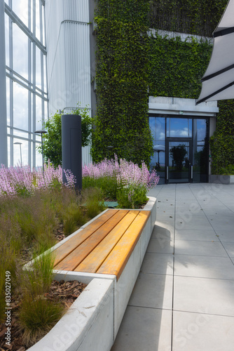 Bench with garden in a glass atrium