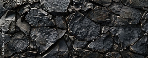 Black background of cracks and rocks pattern for wallpaper or web design.