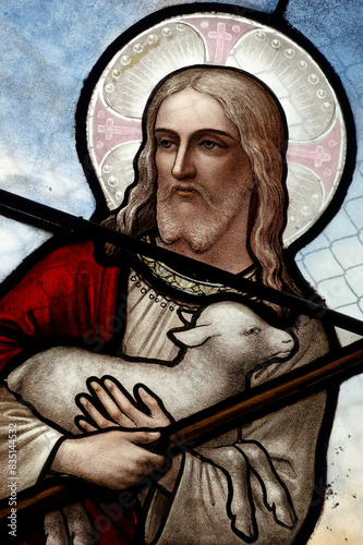 Stained glass window depicting Jesus the Good Shepherd. Vitrail représentant Jesus le Bon Pasteur.