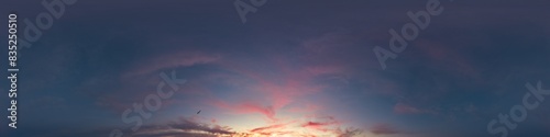 Dark sunset sky with glowing pink Cirrus clouds. Seamless spherical HDR 360 panorama. Full zenith or sky dome in 3D, sky replacement for aerial drone panoramas. Climate and weather change.