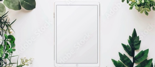 Using a modern e book reader on a white background, a flat lay composition is created with plenty of room for additional text