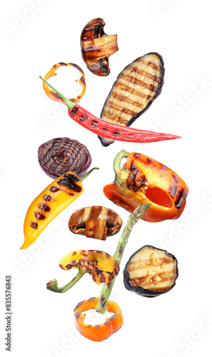 Delicious grilled vegetables in air on white background
