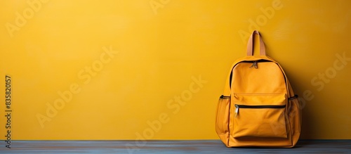Backpack filled with textbooks, symbolizing going back to school, with copy space image.