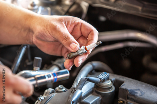 Combustion engine vehicle maintenance, replace of spark plugs