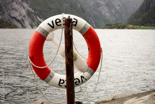 Rescue wheel on the shore of lake in Norway