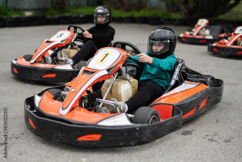 Children Enjoying Go-Kart Racing Outdoors for a Fun and Exciting Adventure