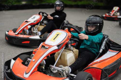 Children Enjoying Go-Kart Racing Outdoors for a Fun and Exciting Adventure