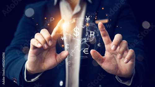 Global currency exchange concept, Businessman holding virtual world map and dollar yuan yen euro and pound sterling sign. Global business, international trading currency, world economy money, transfer