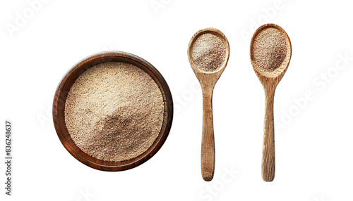 Bowl and spoon with active dry yeast isolated on white