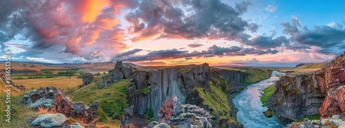 panoramic view of the beautiful basalt columns and blue river inland with a dramatic sky sunset,