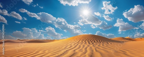 明るい青空の下で太陽に照らされた砂丘の砂漠 