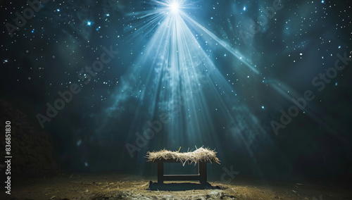 Christmas Nativity scene with an empty manger and a guiding star in a starry sky.