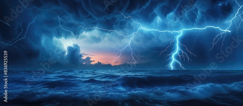 Powerful lightning bolts striking the ocean with a dramatic effect in a copy space image.