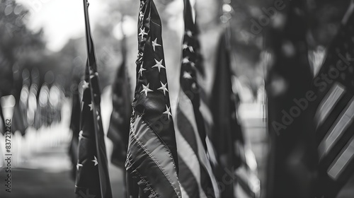 An illustration of the flags in black and white with writing space emphasizing the graveness and enduring reverence for the deceased on Memorial Day