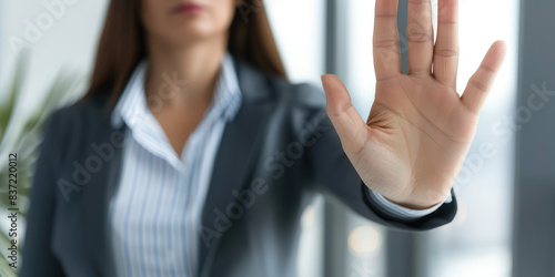 Stop, hand sign and woman in business suit with no gesture for sexual harassment and violence in office workplace