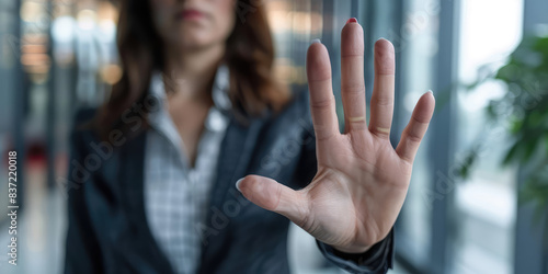 Stop, hand sign and woman in business suit with no gesture for sexual harassment and violence in office workplace