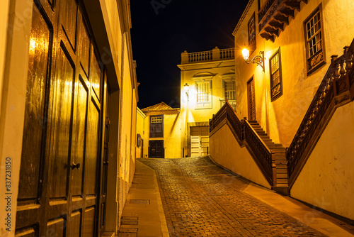 Picturesque streets with white colonial-style buildings at night lit up with street lamps, Santa Cruz, La Palma,