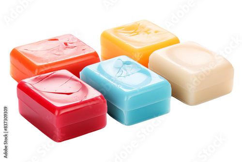 Assortment of colorful, square-shaped, translucent candies arranged on a white background.