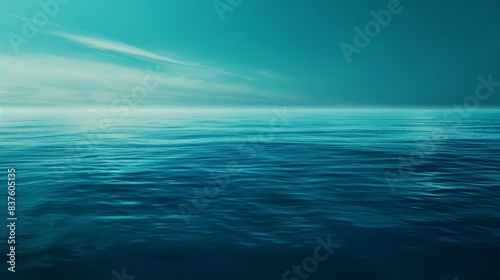 Calm blue ocean with a bright horizon and faint white clouds. A peaceful seascape perfect for a background.