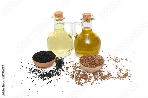 Olej lniany tłoczony z siemienia lnianego i świeżo wysikany olej z czarnuszki w butelkach
