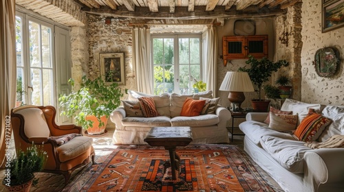Charming Provencal living room, featuring rustic stone walls and wooden ceiling beams. cozy sofa, vibrant throw pillows, and traditional furniture create warm