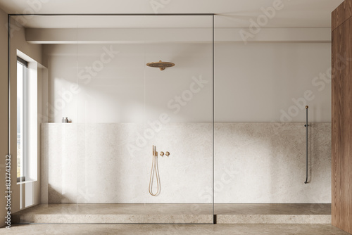 Beige bathroom interior with shower, accessories and panoramic window