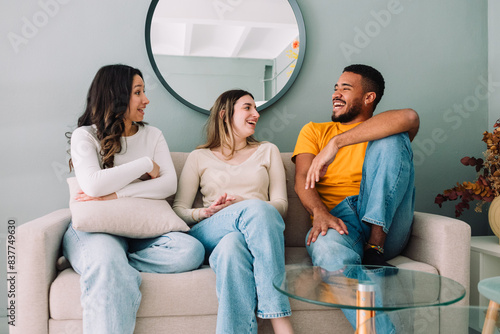 Multi ethnic group of friends relaxing on student accommodation