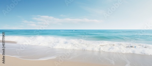 Scenic ocean coast with a sunny beach and white sand, perfect for vacation postcards with copy space image.