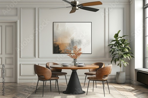 A modern ceiling fan with a brushed brass finish and reversible blades in matte black and walnut, blending seamlessly into a chic and eclectic dining room with mid-century modern furnishings