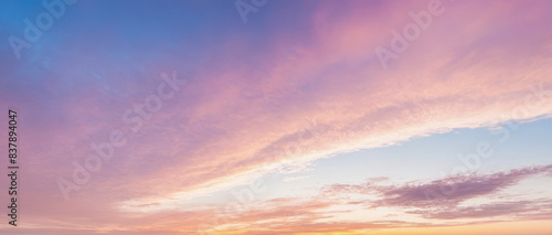 Sunset Cloudscape Panorama with Pink and Purple Hues, Serene Sky, Vibrant Sunset Colors, Soft Cloud Patterns, Peaceful Evening Atmosphere, Colorful Twilight Skyline