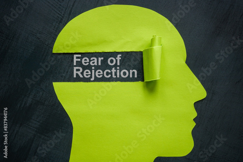 Fear of rejection concept. Paper head and torn off piece.