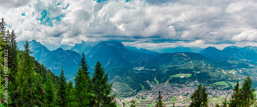 hiking in Mittenwald, Bavaria, Germany. view from Mountain Kranzberg to the famous old town with historic buildings in Mittenwald city 