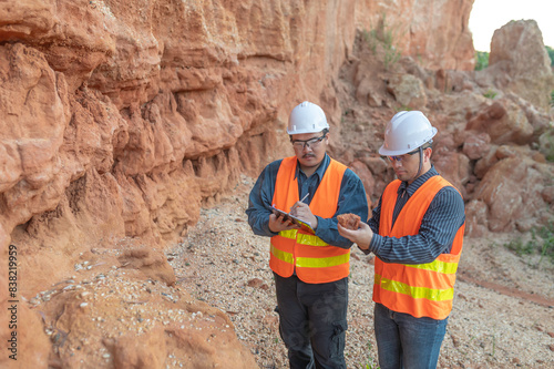 Geologist surveying mine,Explorers collect soil samples to look for minerals.