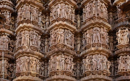 Splendid ancient sculptures and intricate designs on the wall of Kandariya Mahadeva Temple in the Khajuraho temple complex, India