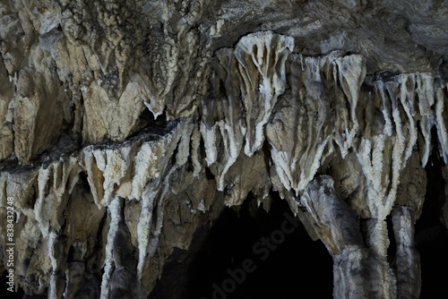 Rock formations and abstract texture on the walls in Muierilor Cave with stalactites and stalagmites