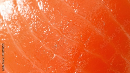 Elevate your palate: Impeccable salmon sashimi boasting a rich, deep orange hue and fine marbling. The glossy texture ensures a decadent, melt-in-your-mouth experience, redefining culinary elegance. 