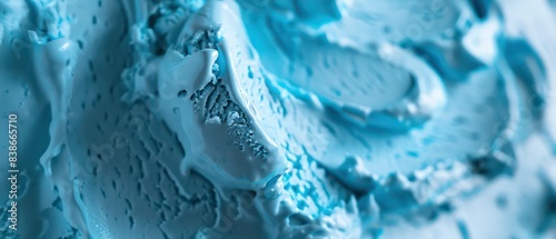 Soft blue gelato with contrasting textures, featuring a velvety base and crunchy accents
