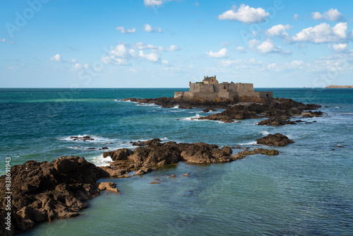 Petit Be Fort on a small island in the waters of the English Channel near the walls of the fortress city of Saint-Malo on a sunny summer day, Saint-Malo, Brittany, France