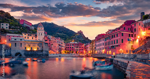 Amazing sunrise on the one of five towns that make up the Cinque Terre region - Vernazza. Wonderful morning scene of Liguria, Italy, Europe. Calm seascape of Mediterranean sea.