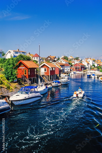 Boats in a sea canal at an old swedish fishing village in the summer