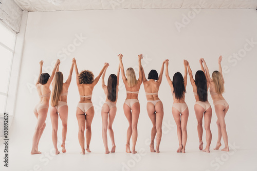 Back rear spine photo with no retouch of girls raise hands feel body self confidence isolated pastel color background