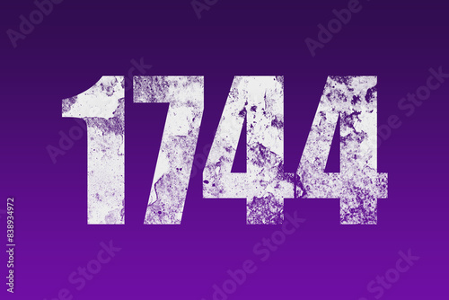 flat white grunge number of 1744 on purple background. 