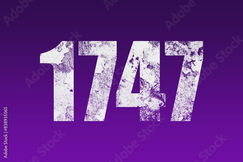 flat white grunge number of 1747 on purple background. 