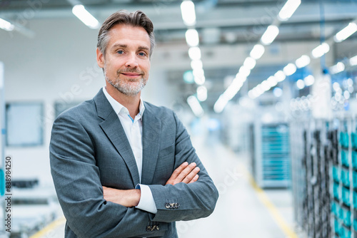 Portrait of a confident businessman in a modern factory