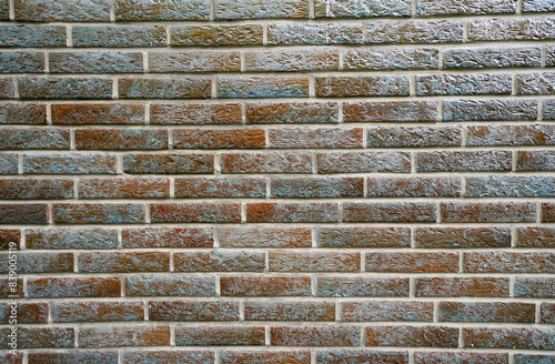 Gray brown glazed clinker brick close-up. Background. 
