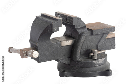 Old black vise on white background. Working tool. Metal vise with rust.