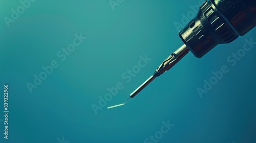 A close-up of a soldering iron and solder wire, positioned against a solid sky blue background, demonstrating the precision and control required for soldering electronic components and circuit boards.