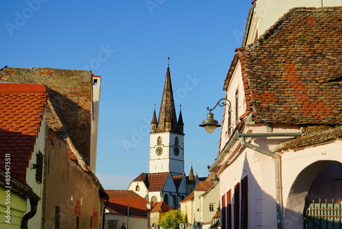 Lutheran Cathedral tower visual through the buildings in Sibiu, Transylvania, Romania