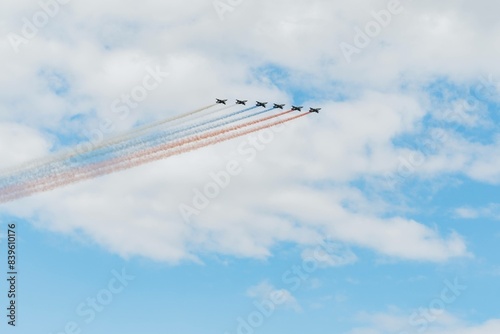 Navy day in Saint Petersburg. Russian air force planes paint the colors of the russian flag tricolour in the sky 