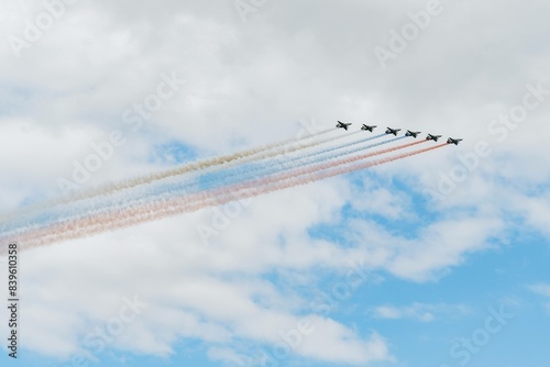 Navy day in Saint Petersburg. Russian air force planes paint the colors of the russian flag tricolour in the sky 